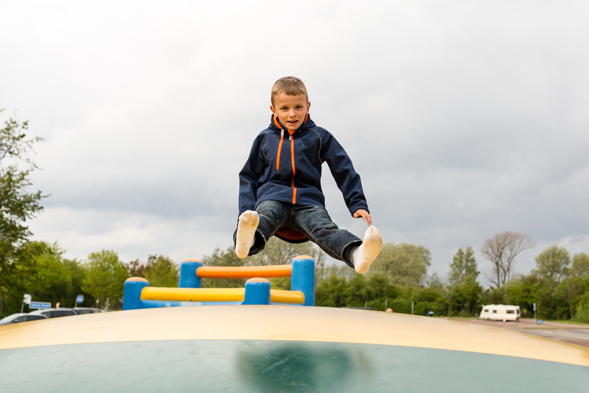 Boy jumping on a playground