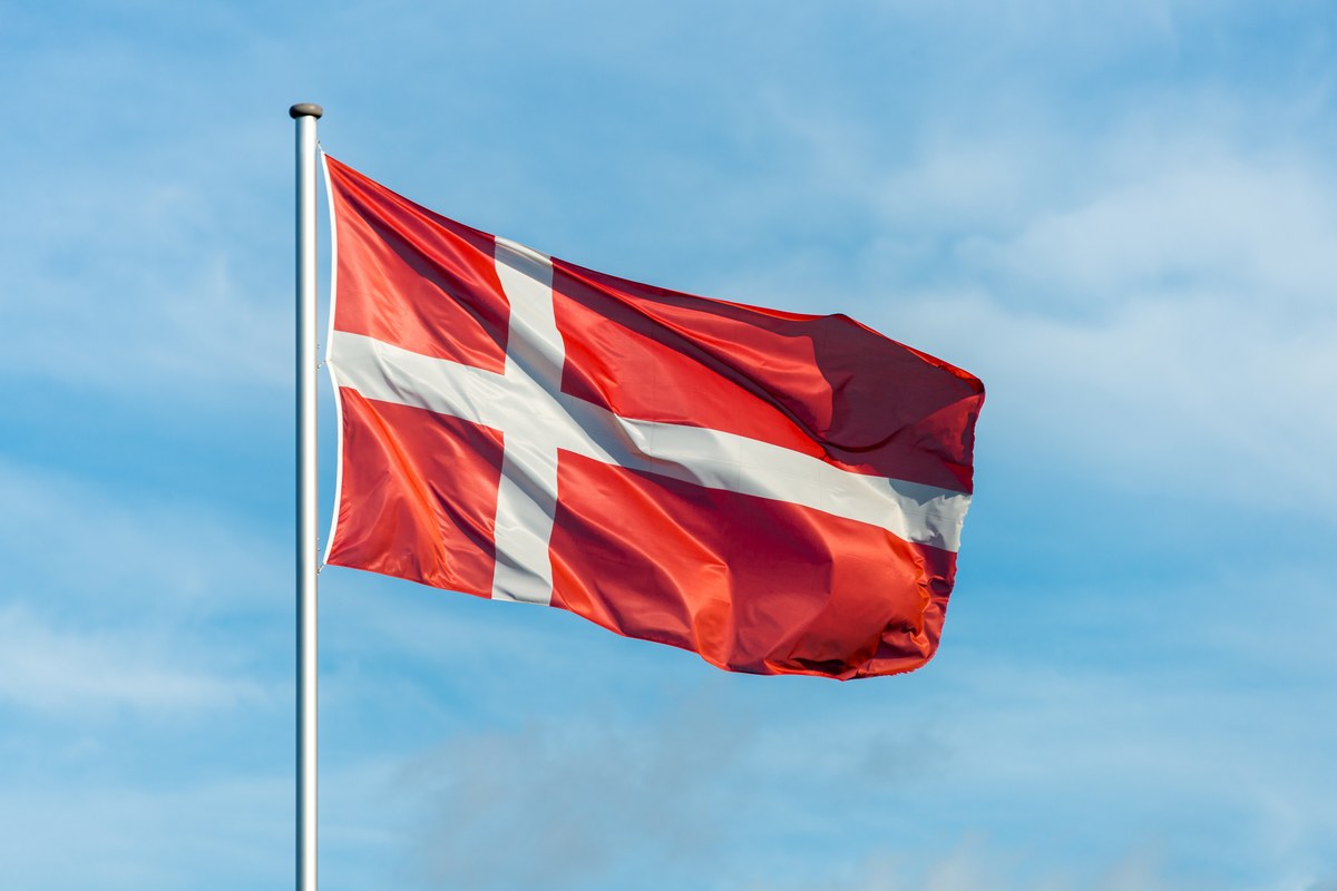 The Danish flag against a blue sky