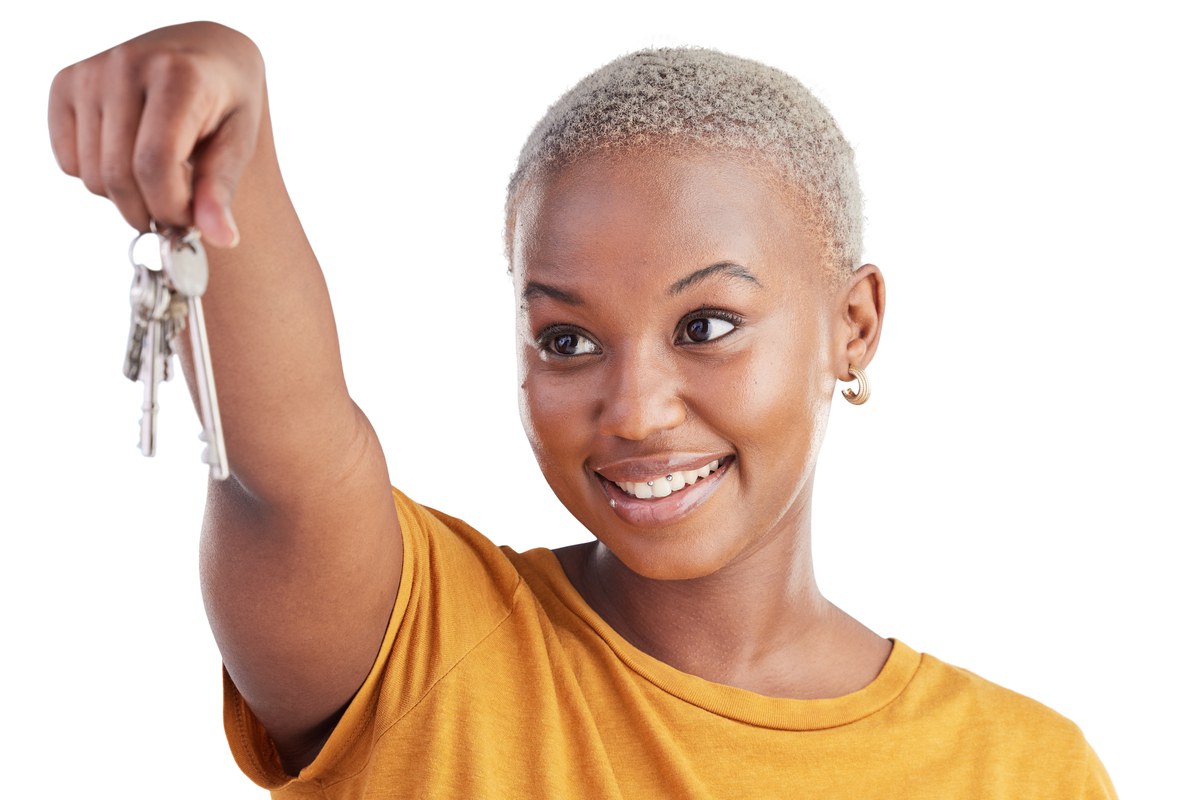 Smiling woman holding up a set of keys