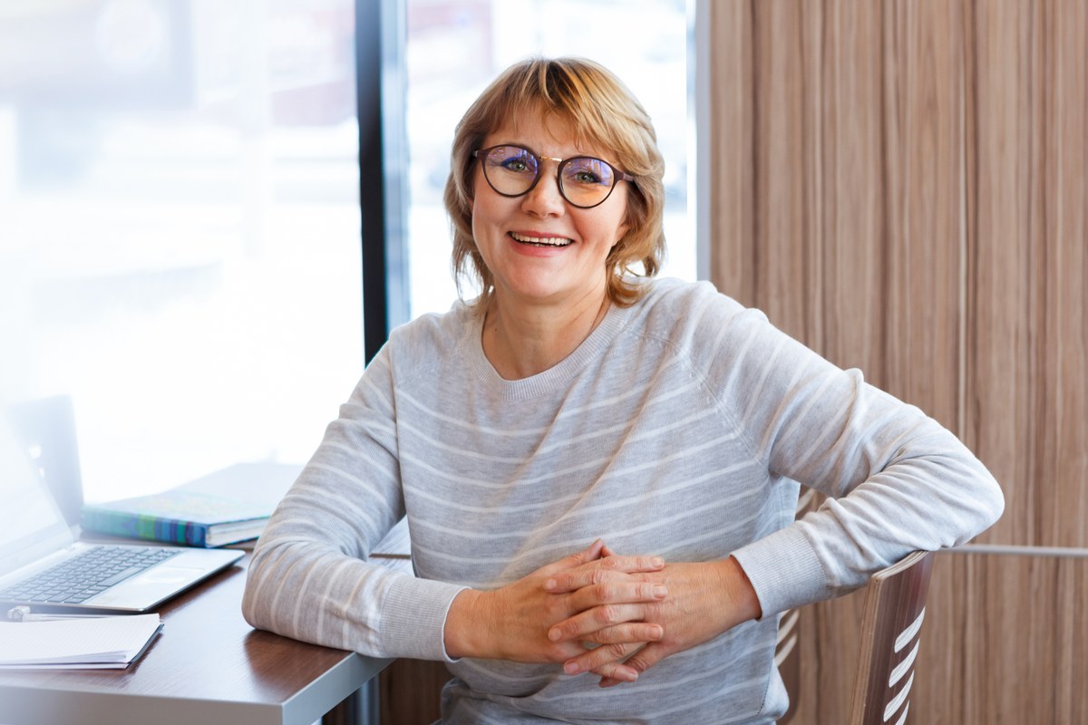 Smiling woman at her desk