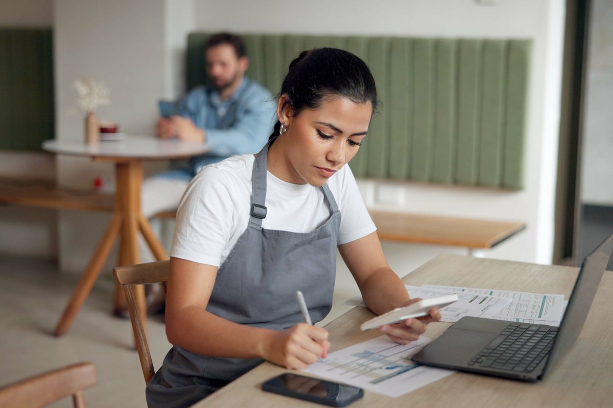 Woman working through paperwork