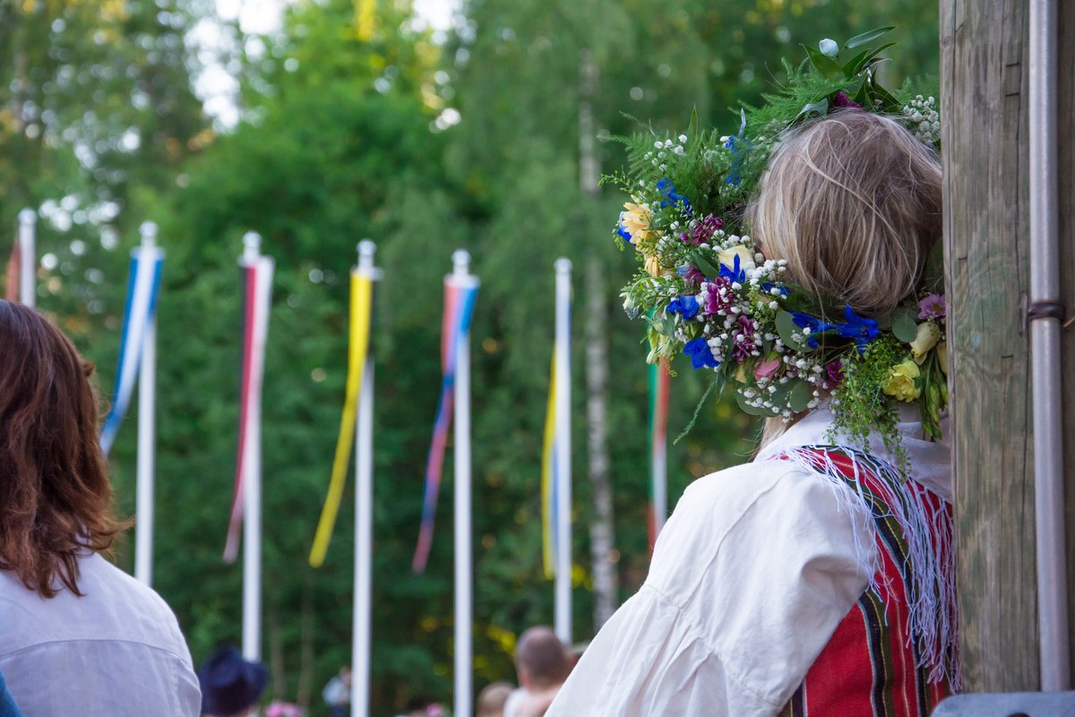 Woman with a flower crown at a midsummer celebration