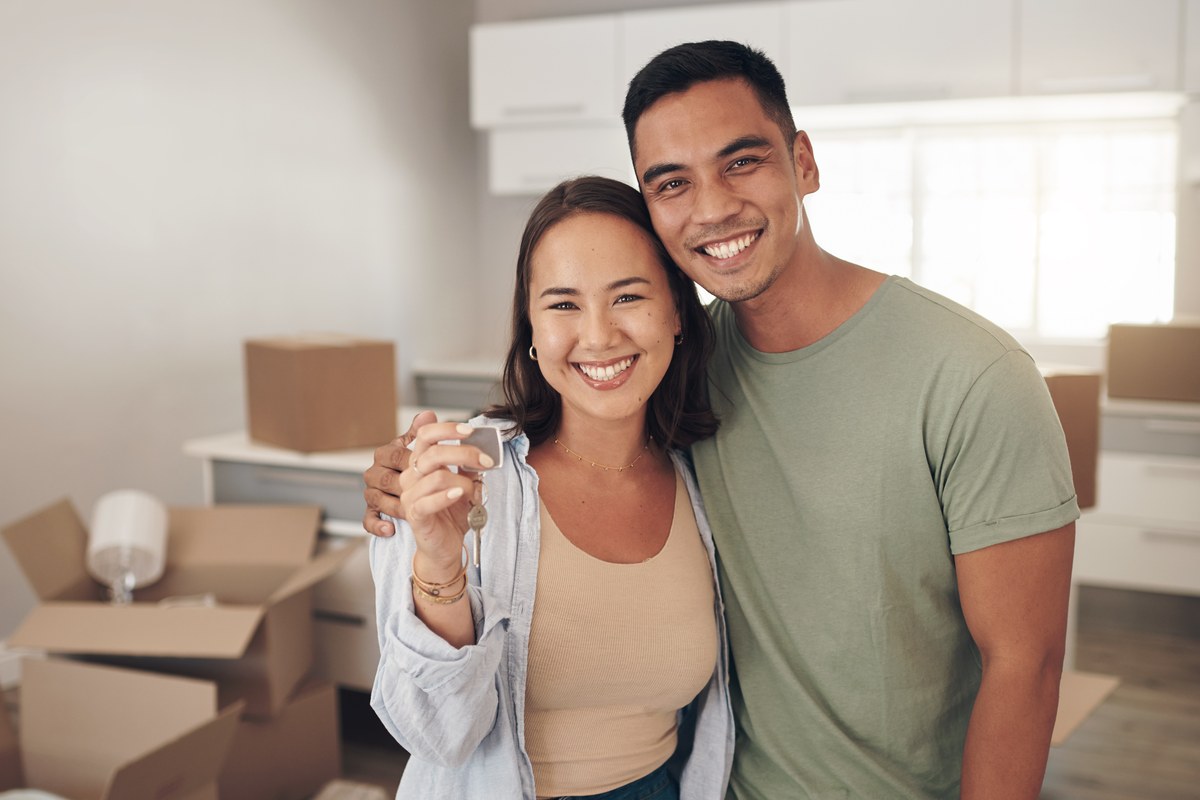 Couple with the keys to their new home