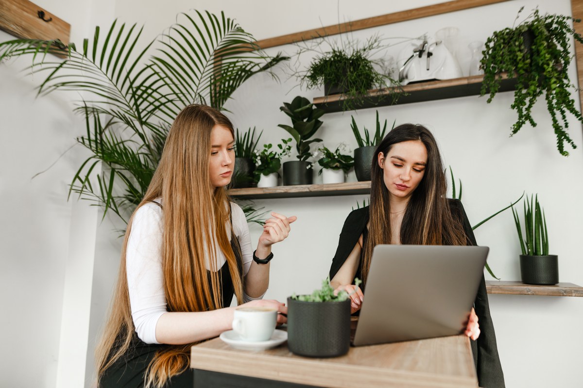 Two women working together in a bright office