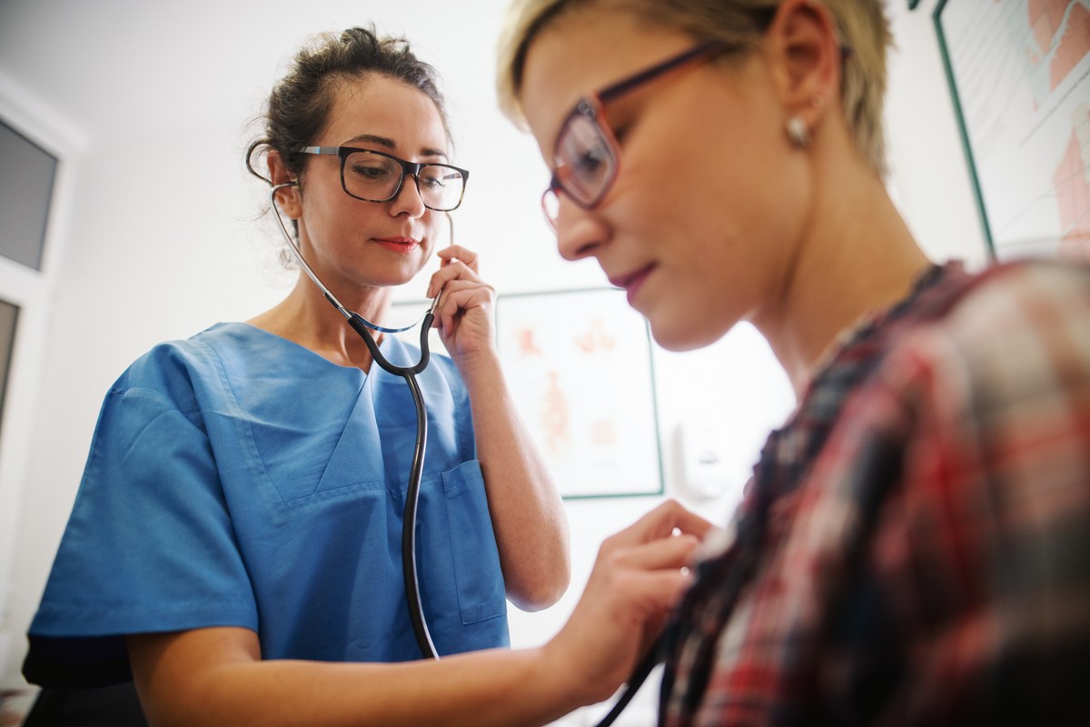 Doctor listening to a patient’s breathing