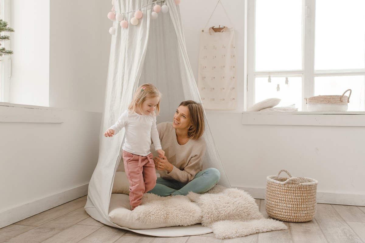 Mother playing with her toddler at home